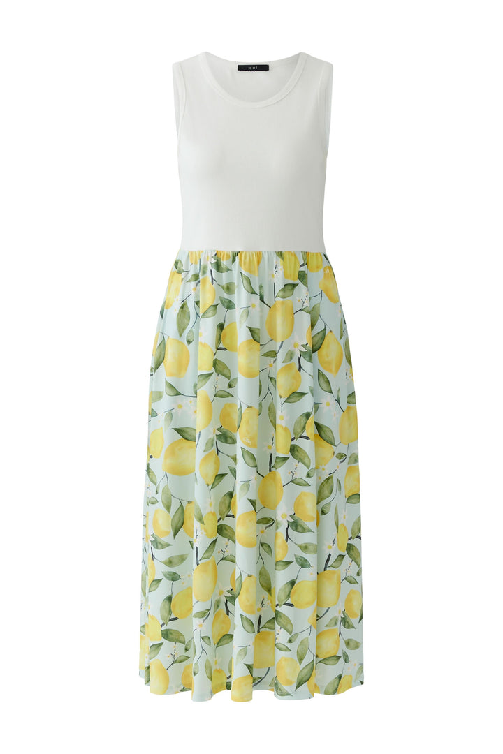 Robe longue sans manches à jupe fluide avec motif citron, encolure ronde, coupe ajustée, idéale pour un style élégant et décontracté.