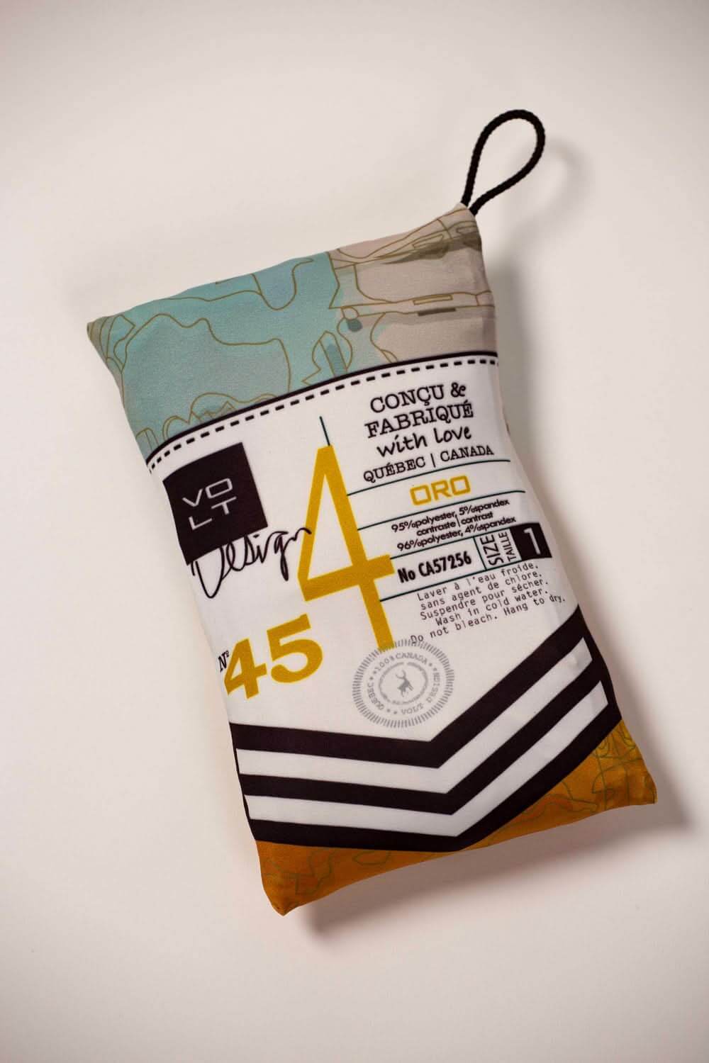 Robe t-shirt Oro travel pouch design featuring colorful patterns and branding in a compact size.