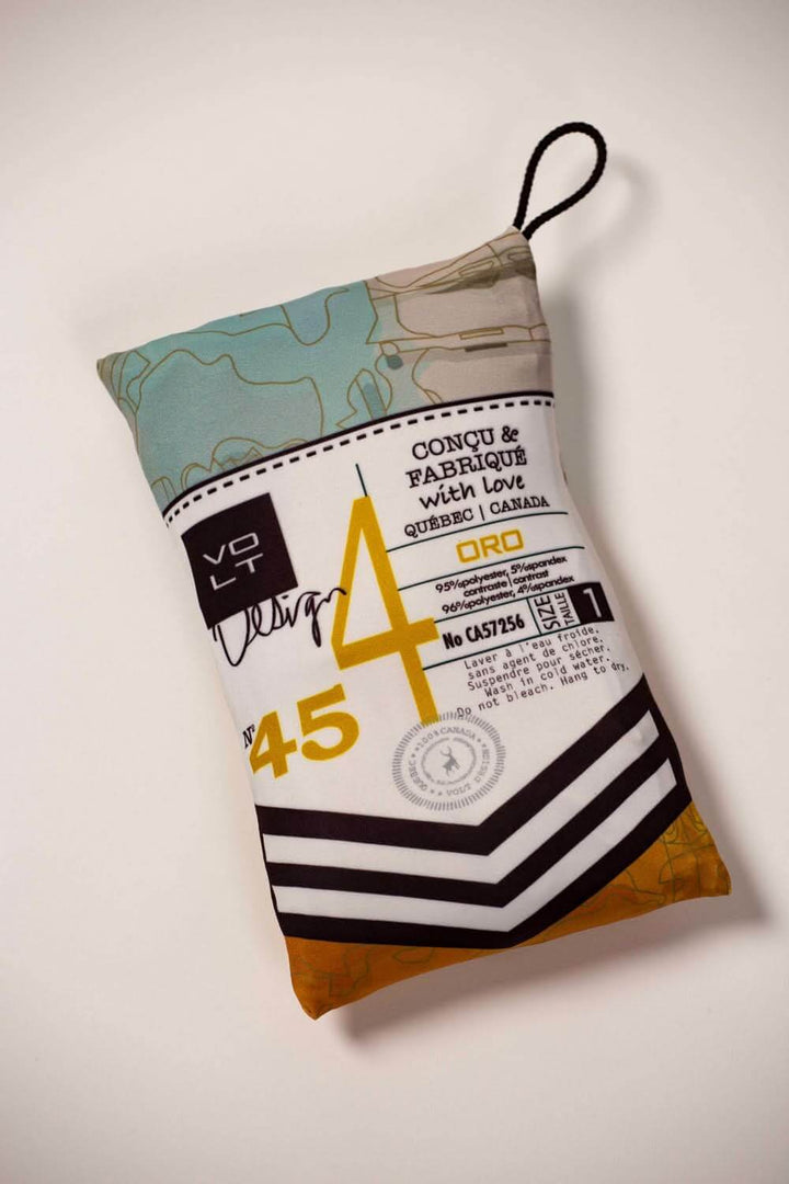 Robe t-shirt Oro travel pouch design featuring colorful patterns and branding in a compact size.