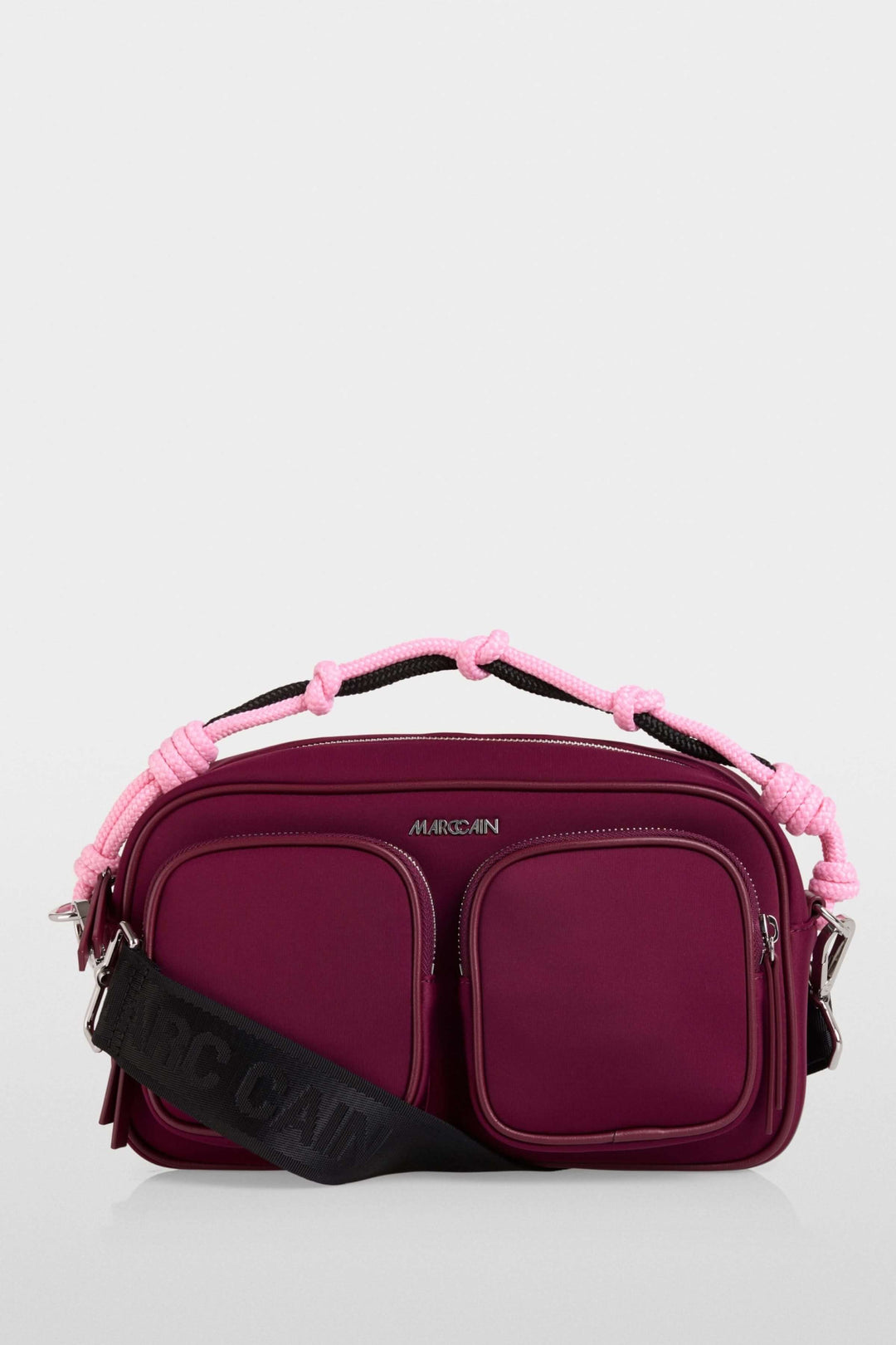 Sac bandoulière en néoprène avec poignée tressée rose et bandoulière large ajustable, design moderne et fonctionnel.