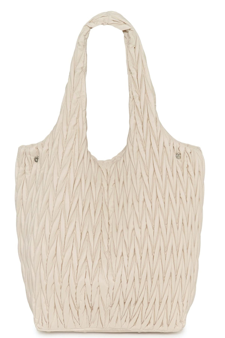 Sac fourre-tout matelassé Samy en tissu beige avec texture distinctive.