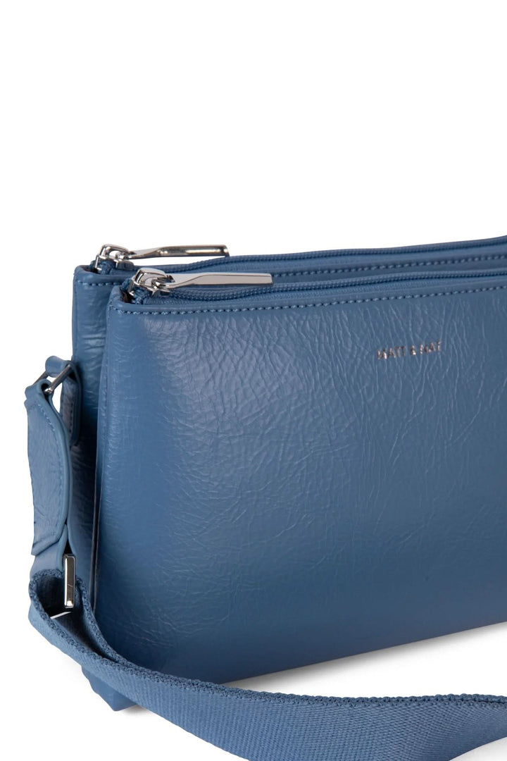 Sac à mains Indie en cuir bleu avec deux compartiments zippés et bretelle ajustable