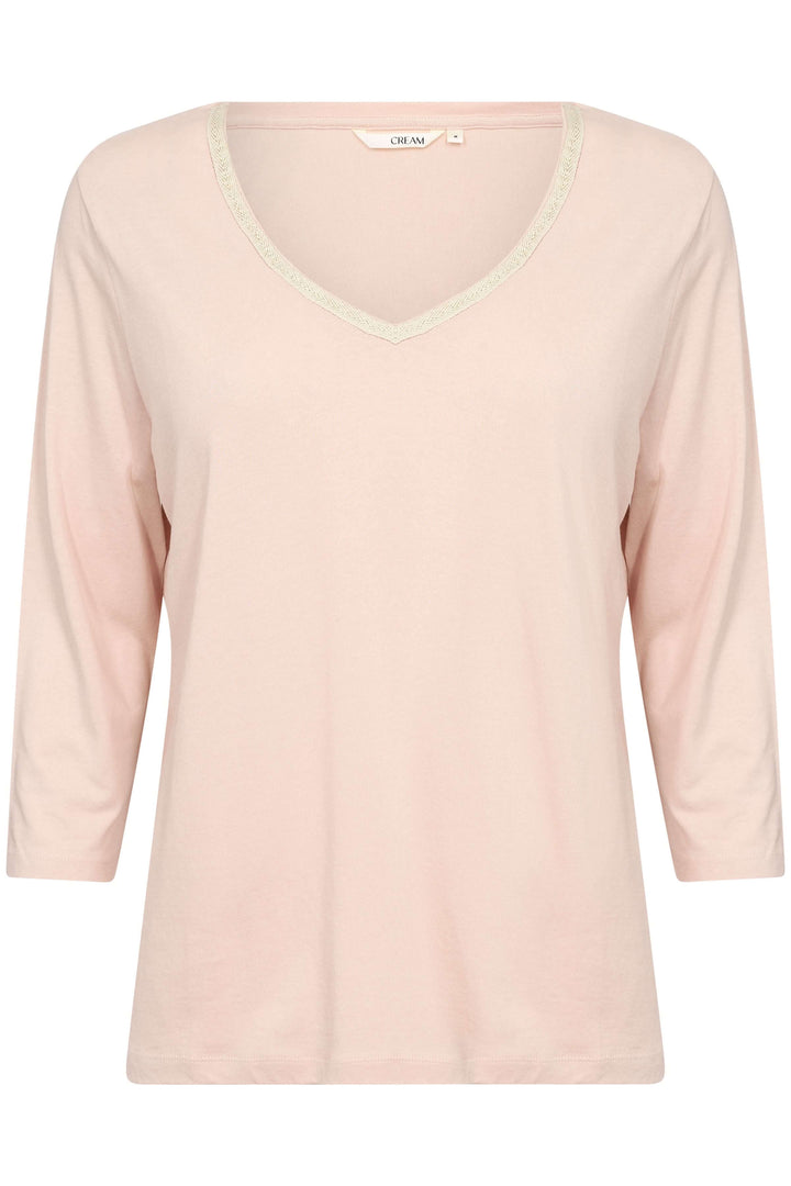 T-shirt Naia en coton doux, col en V avec ruban scintillant, manches trois-quarts, couleur rose pale.