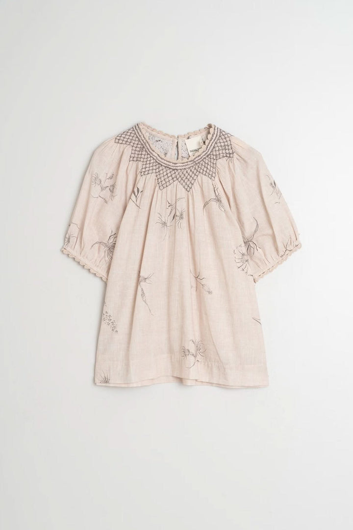 T-shirt avec détails au crochet, col smocké, manches bouffantes, imprimé floral délicat.