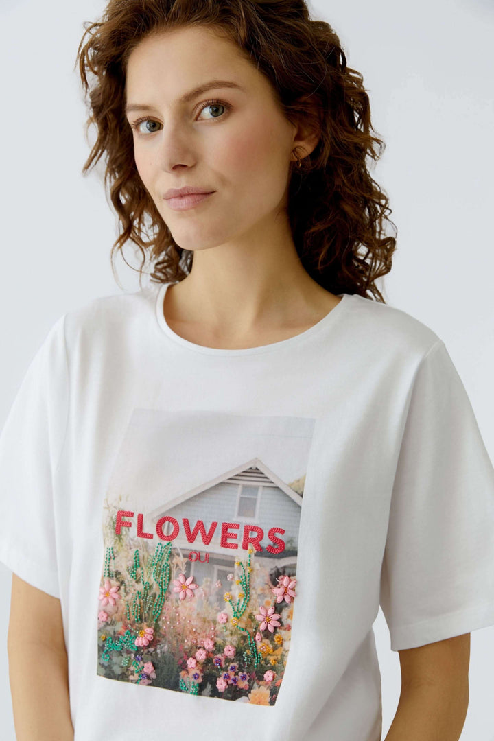 T-shirt imprimé graphique avec visuel 'Fleurs', coupe droite et confortable, idéal pour un style décontracté et moderne.