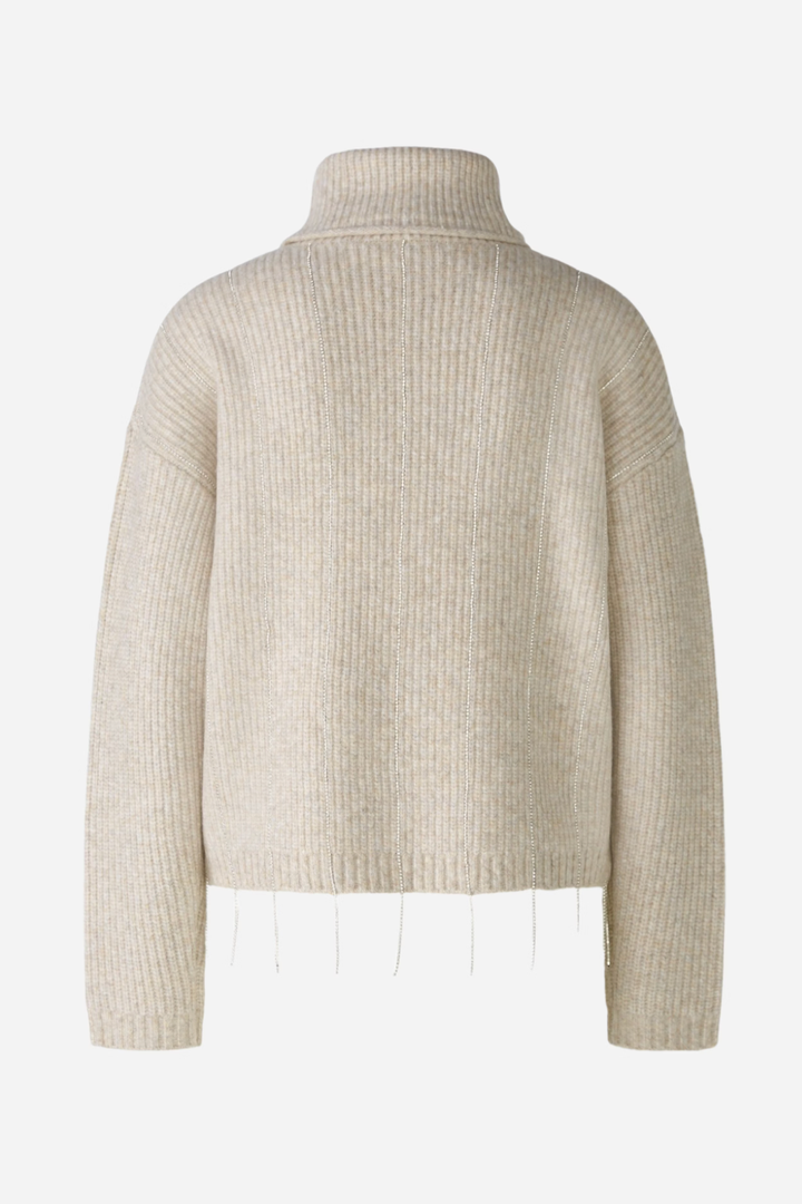 Tricot avec col roulé, maille côtelée et fils pailletés, vue arrière, style décontracté et moderne.
