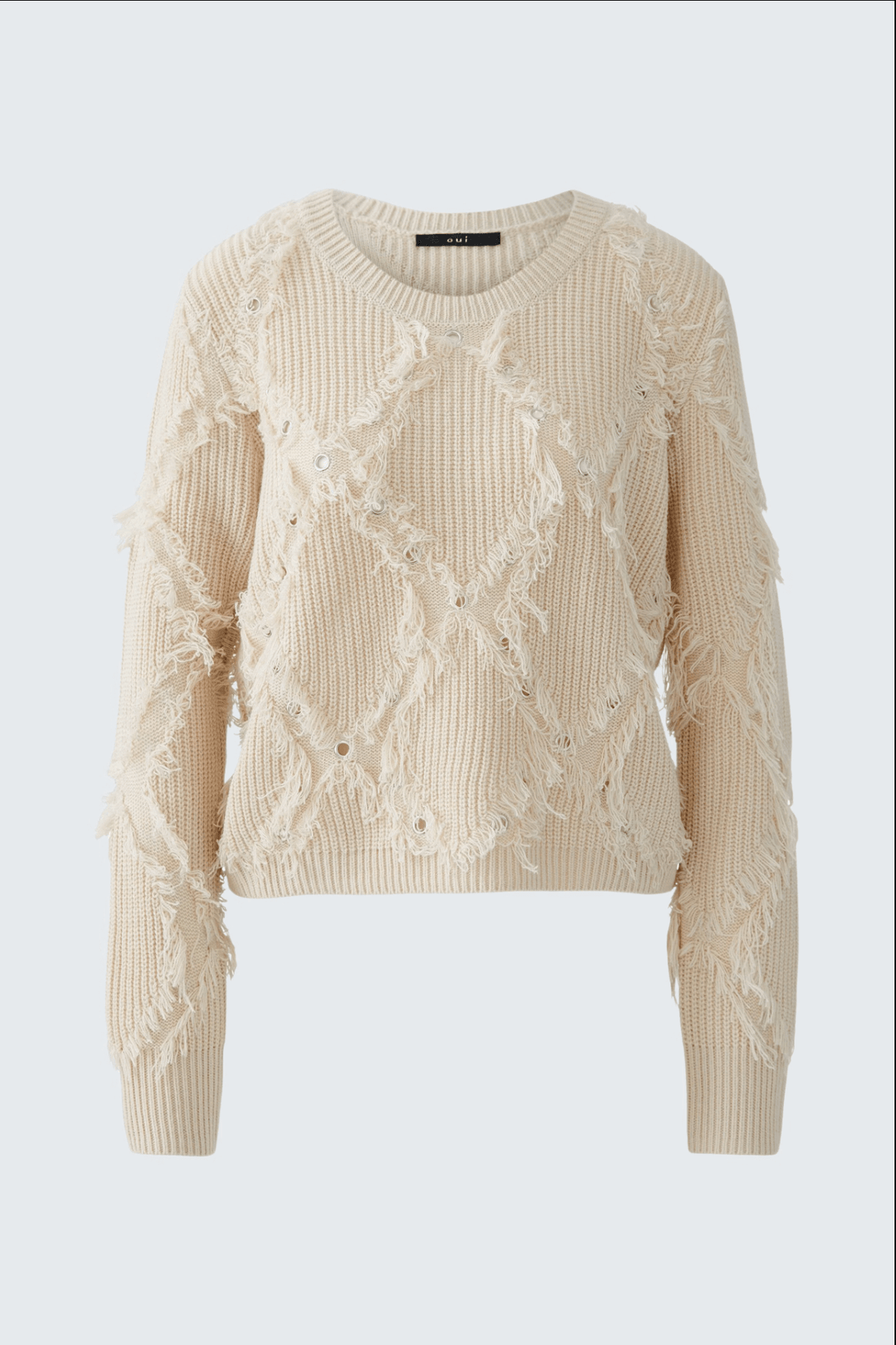 Tricot motif losange beige avec franges, coupe décontractée et col ras du cou, texture originale et détails modernes.
