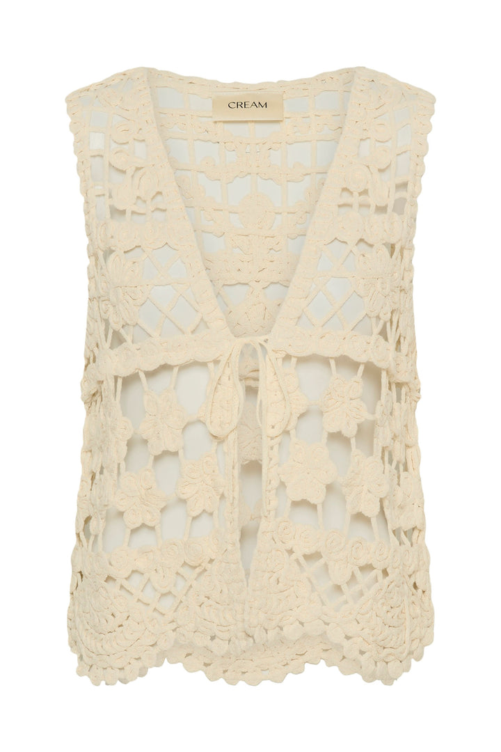 Veste Lotu sans manches en crochet avec motif floral texturé et encolure en V, parfaite pour un style bohème et élégant.