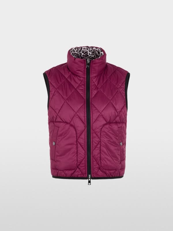 Veste sans manche réversible, matelassée avec un côté imprimé léopard et l'autre uni, fermeture éclair et poches latérales.