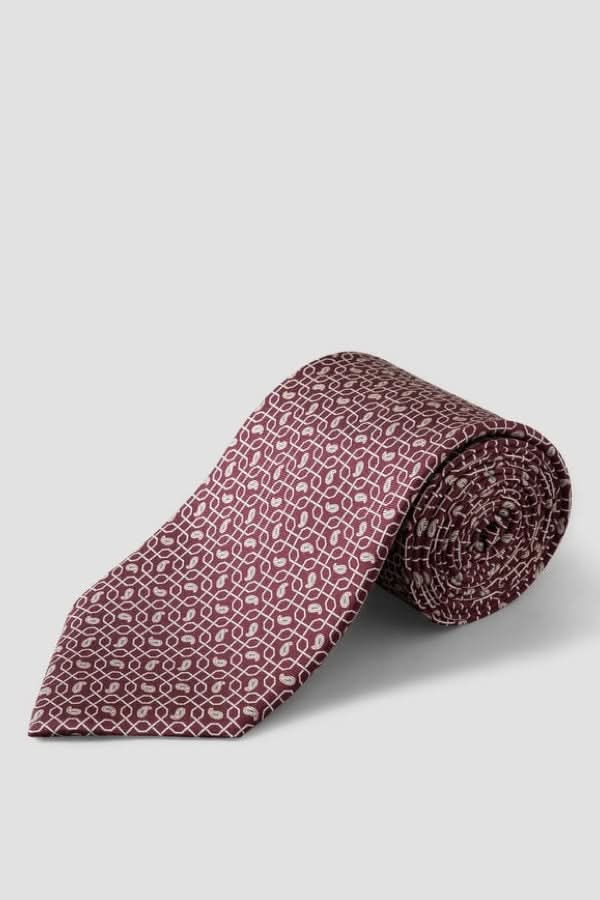 Cravate à motif géométrique en soie italienne avec finition lustrée, idéale pour occasions professionnelles et élégantes.