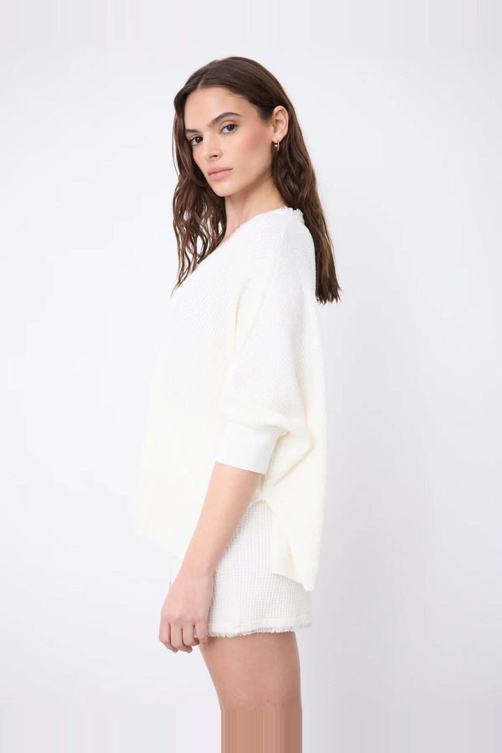 V-neck poncho sweater with three-quarter sleeves