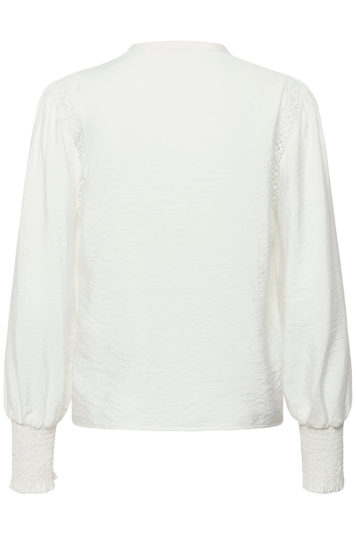 Vue de face blouse Delia dentelle Kaffe pour femme blanc avec détails broderies - Valérie Simon