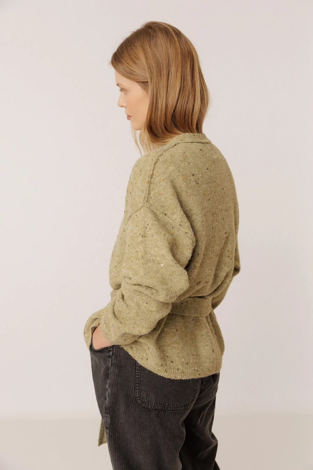 Front view of women's speckled knit cardigan with tie belt Indi & cold