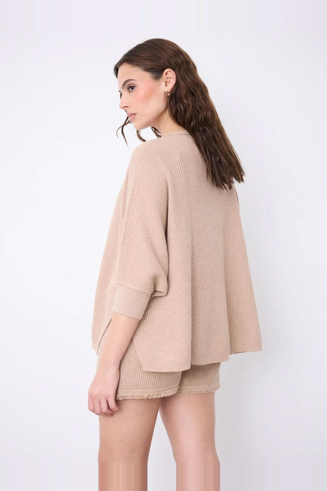 V-neck poncho sweater with three-quarter sleeves