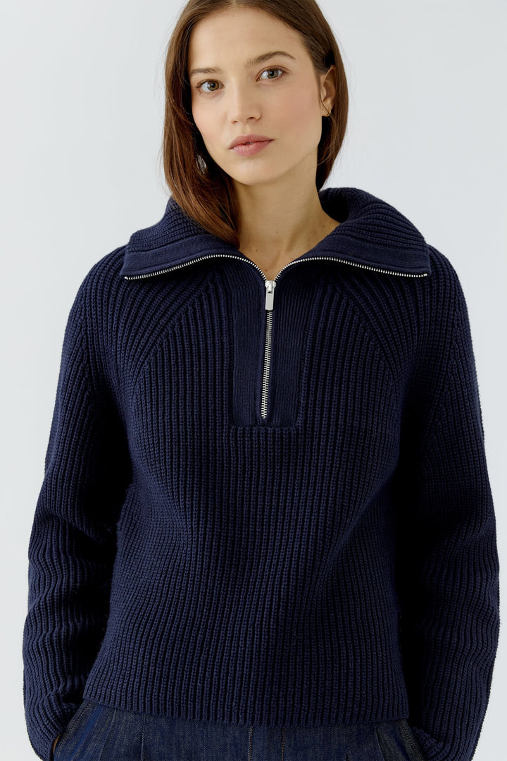 Chandail en tricot côtelé à col zippé vue de face pour femme Oui