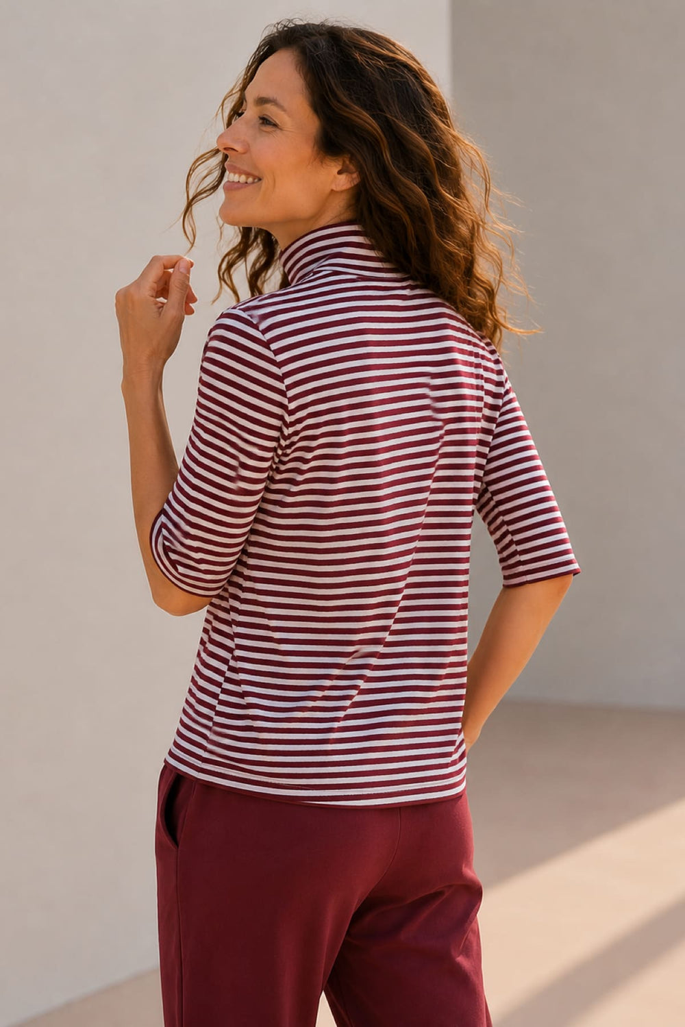 Front view of a striped turtleneck sweater for women by Kennys
