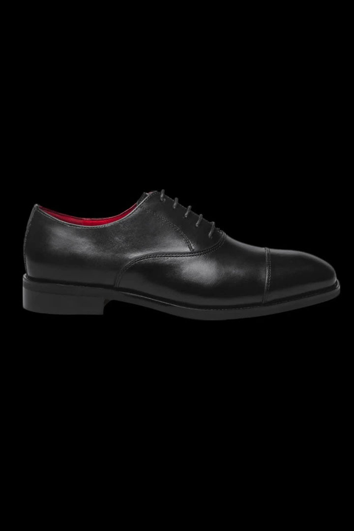 Vue latérale chaussure en cuir noir avec brogue Au noir pour homme - Valérie Simon