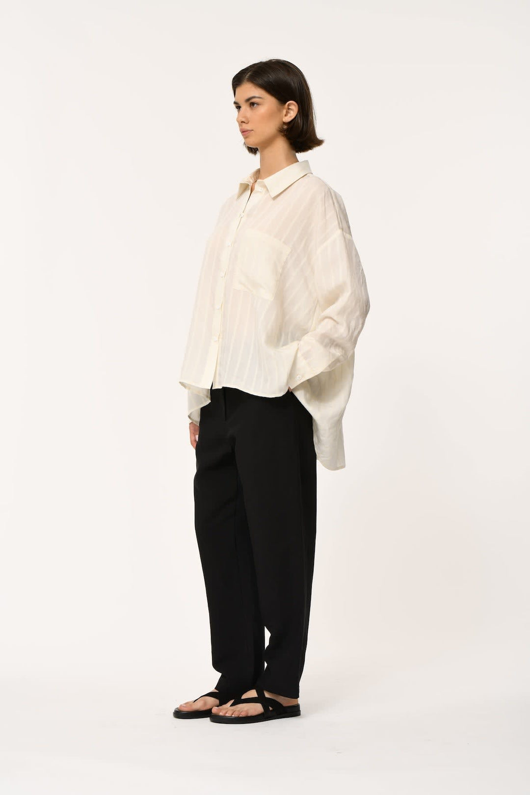 Front view of a flowing striped shirt Humility for women with a classic collar by Valérie Simon