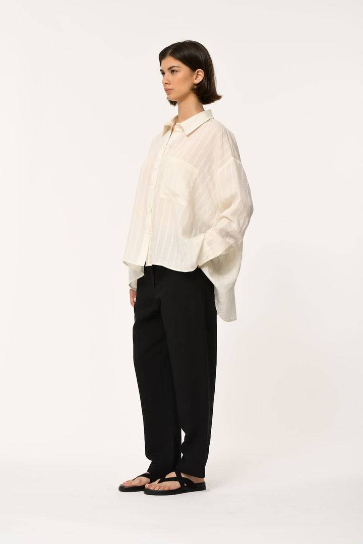 Front view of a flowing striped shirt Humility for women with a classic collar by Valérie Simon
