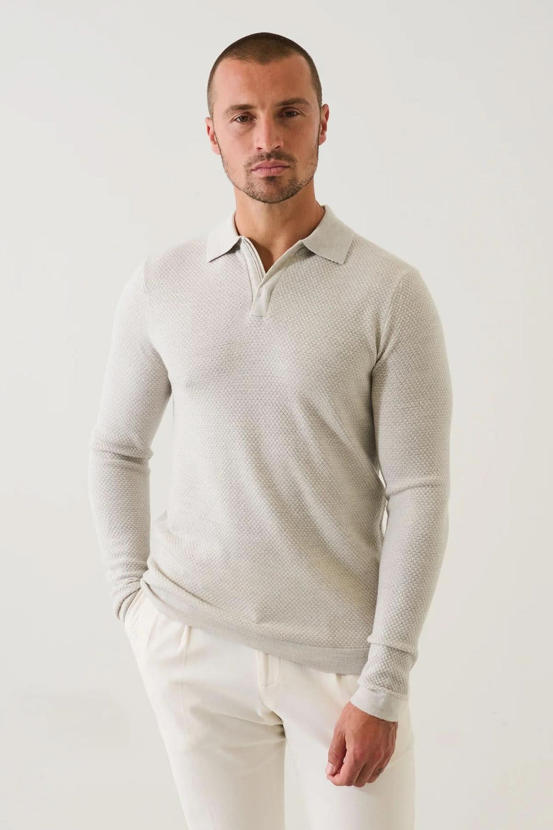 Polo zippé texturé en laine mérinos extra-fine