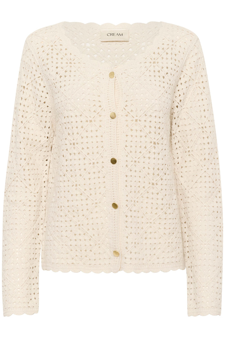 Cardigan ajouré crème avec boutons contrastants et encolure festonnée, idéal pour un look rétro.