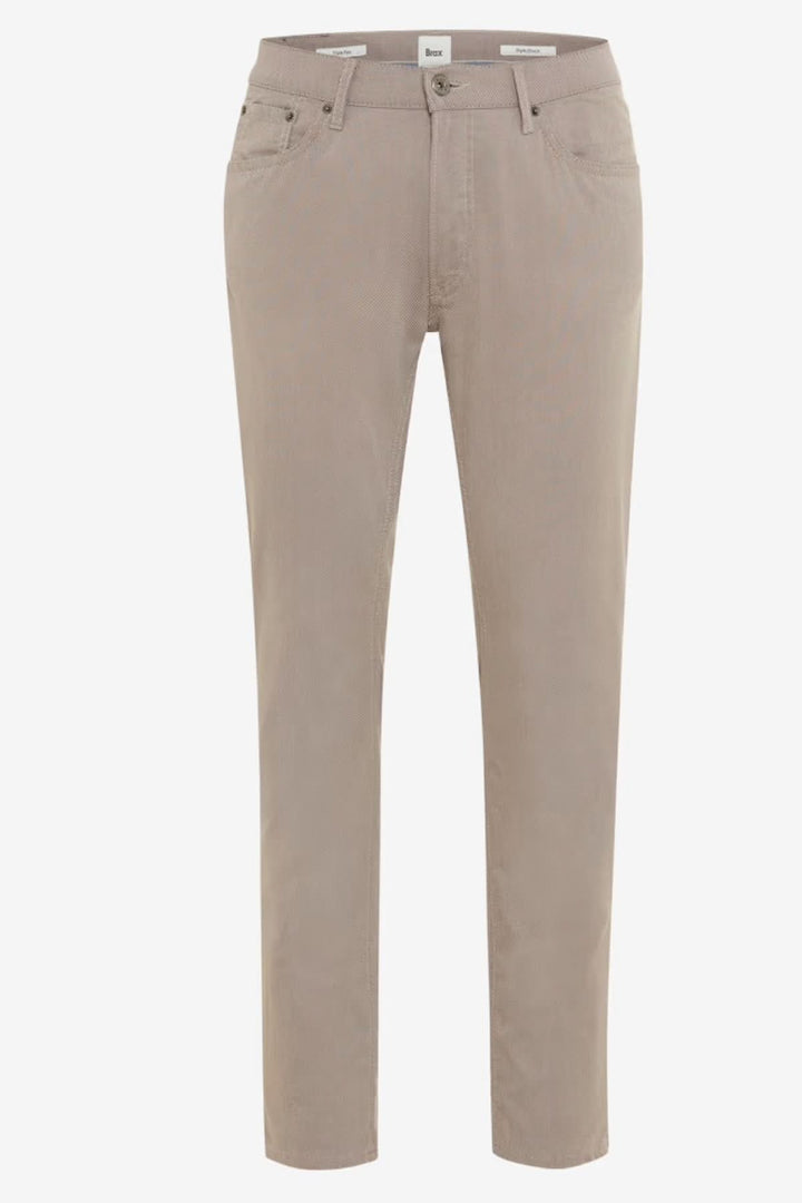 Pantalon ajusté longueur cheville avec poches latérales et arrière, tissu extensible pour un confort optimal.