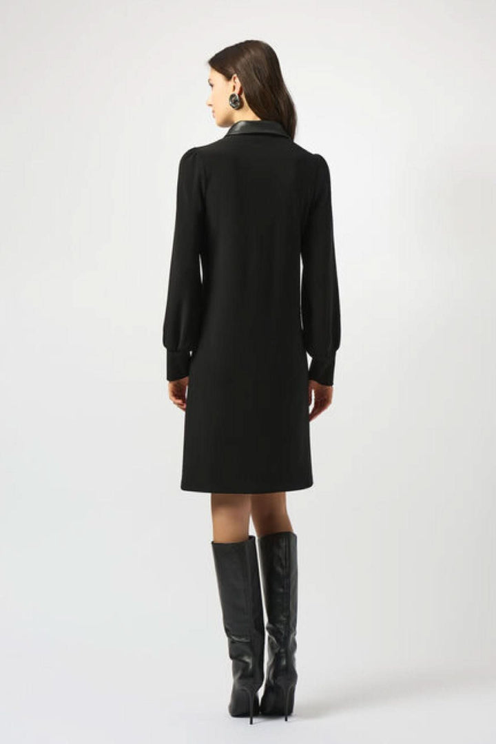 Robe col chemise noire élégante, coupe trapèze, manches bouffantes, vue arrière.