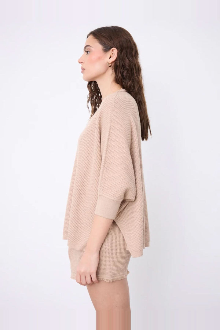 V-neck poncho sweater with three-quarter sleeves