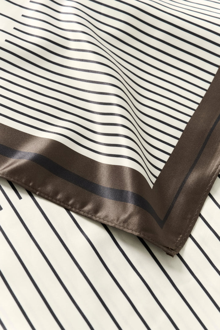 Close-up of a multicolored striped scarf by Kaffe for women - Valérie Simon