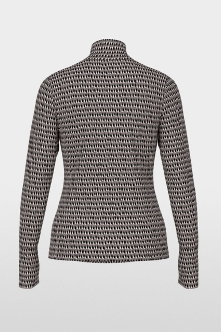 Chandail imprimé pailleté, coupe près du corps avec col montant, manches longues et poignets boutonnés, en arrière-plan blanc.