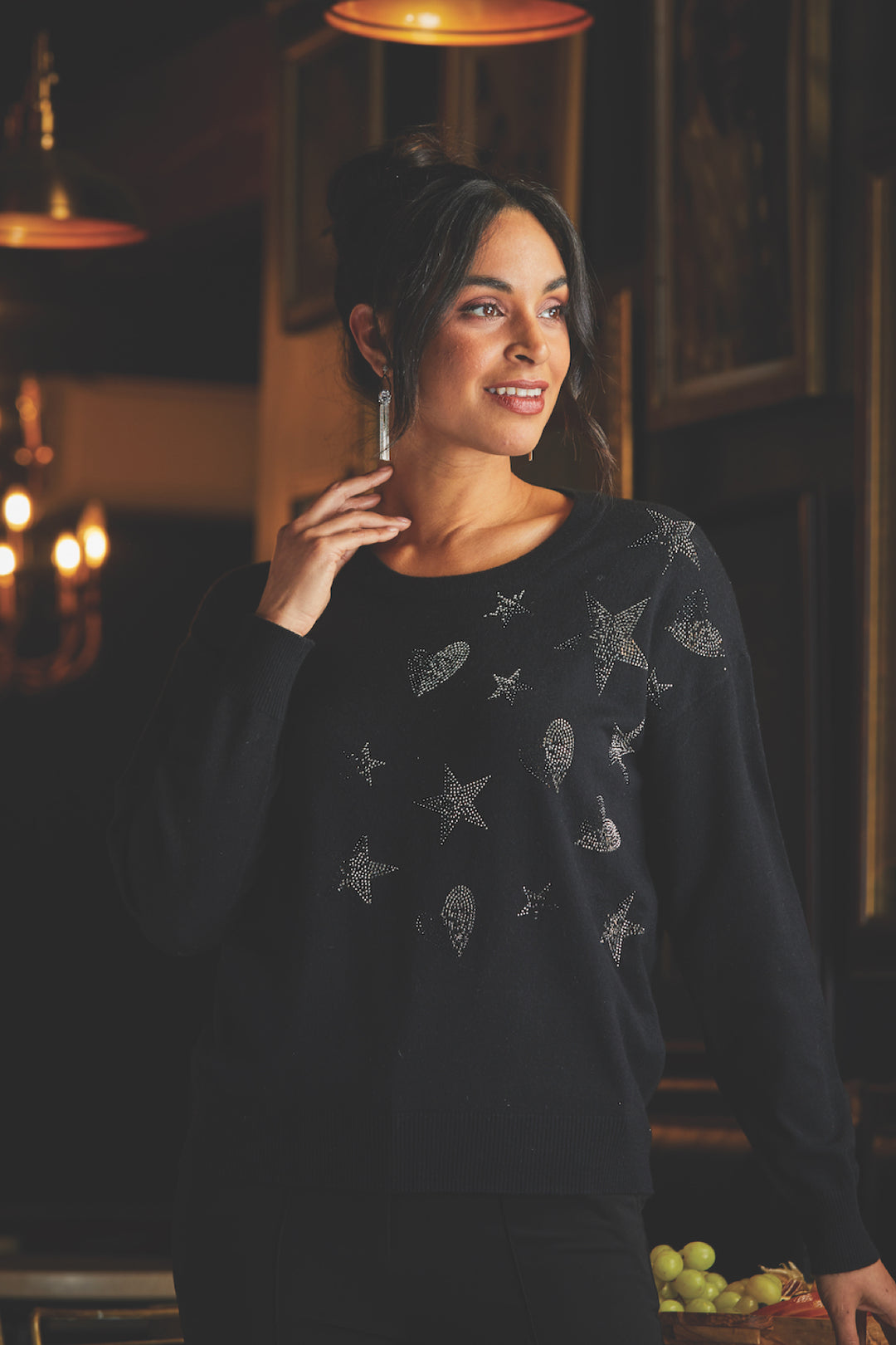 Knitwear decorated with rhinestones