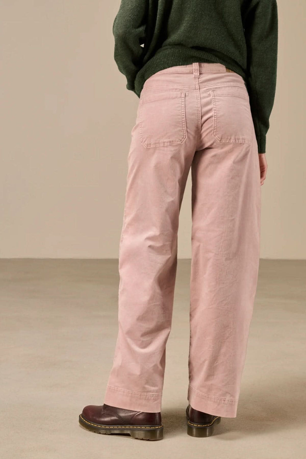 Front view of Nile women's blue wide-leg jeans with patch pockets