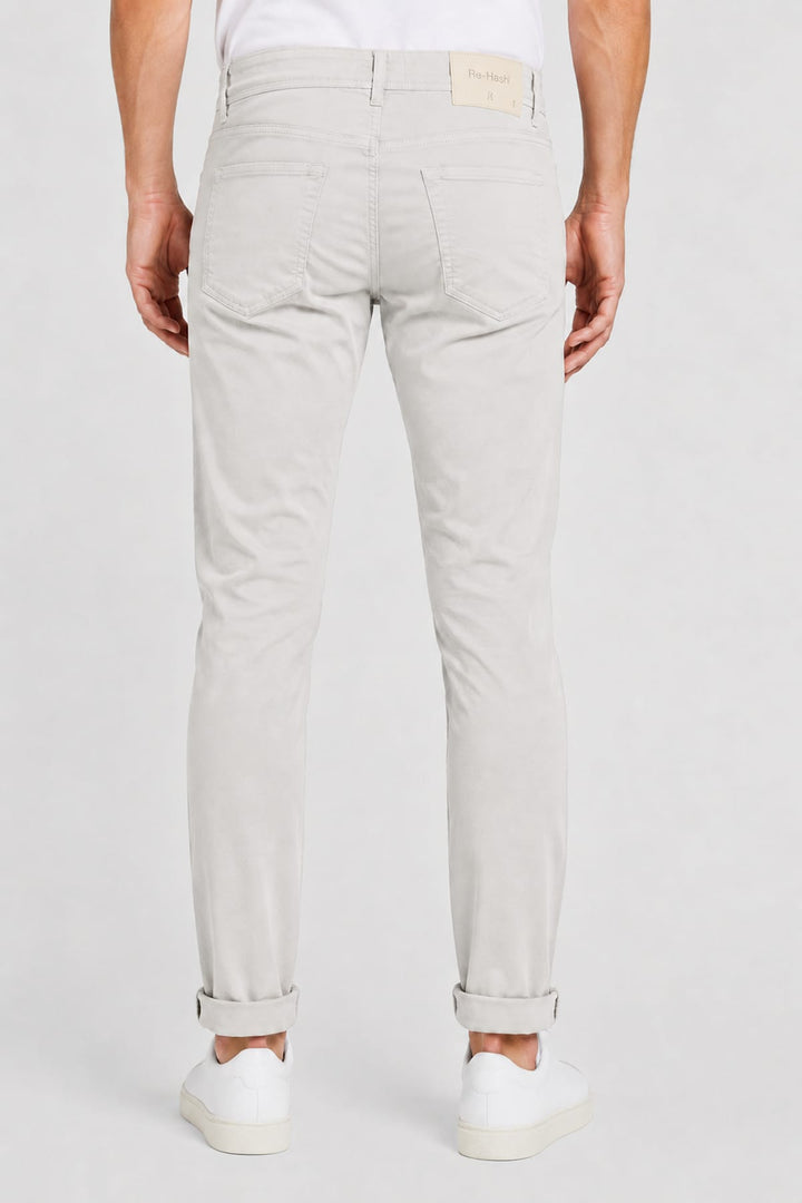 Rear view of REHASH stretch jeans for men in gray with brand label - Valérie Simon
