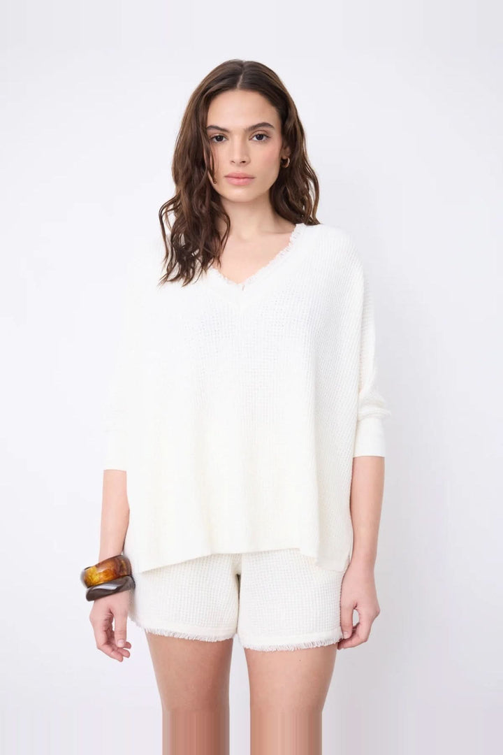 V-neck poncho sweater with three-quarter sleeves