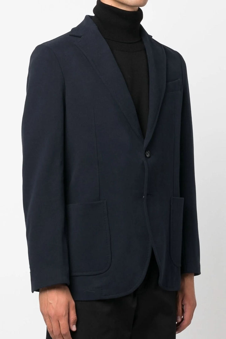 Veston extensible de coton doux avec col à revers et boutons en corne, idéal pour un style élégant et confortable.