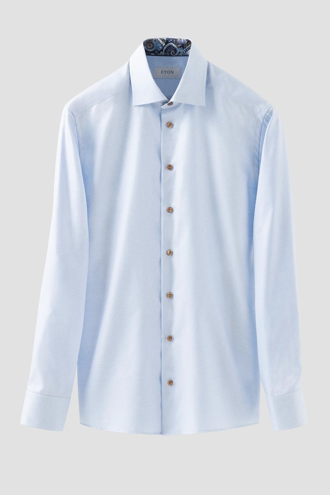 Blue textured shirt with contrasting buttons