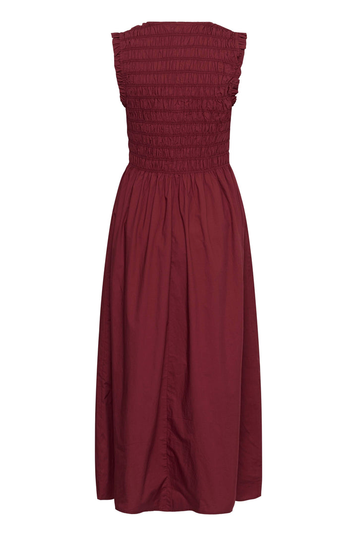 Robe Borgnette longue smockée sans manches, robe féminine et fluide, coupe ajustée et jupe évasée, encolure en V, style élégant.