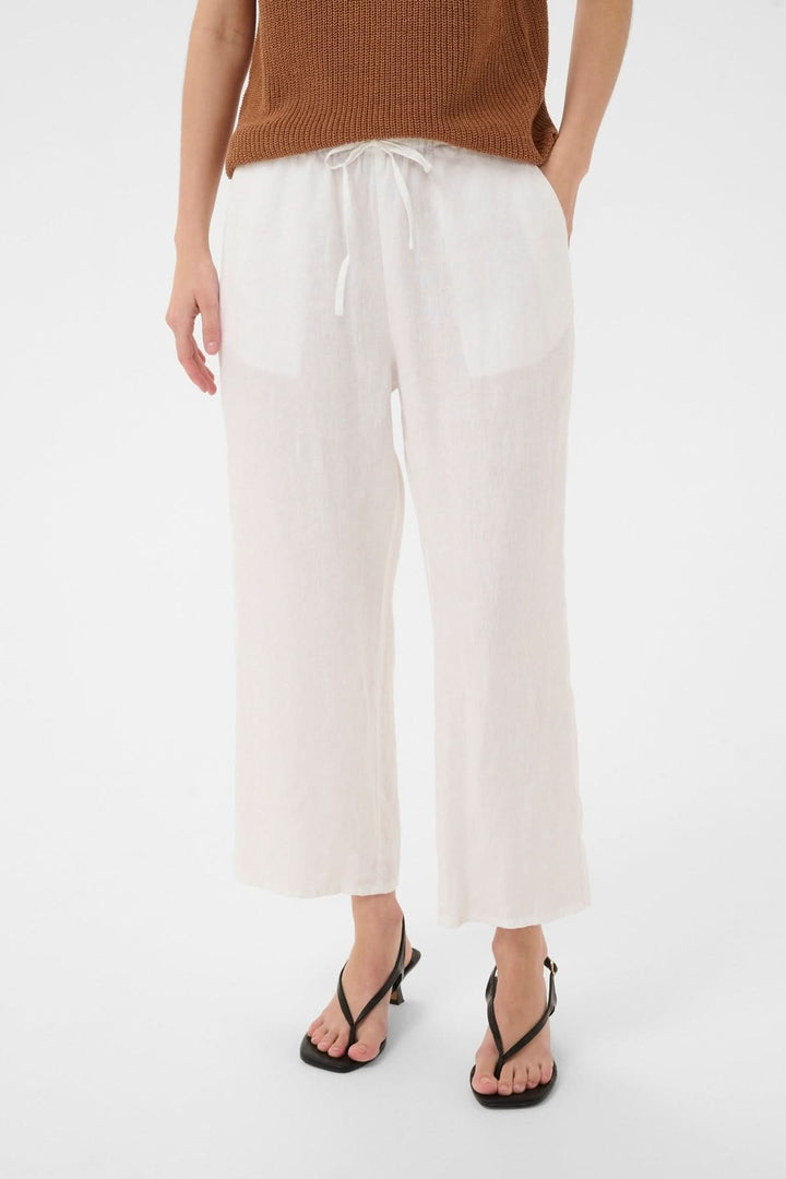 Pantalon de lin Berita fluide à jambe droite, taille élastique avec cordon, poches latérales, tissu léger, idéal pour l'été.