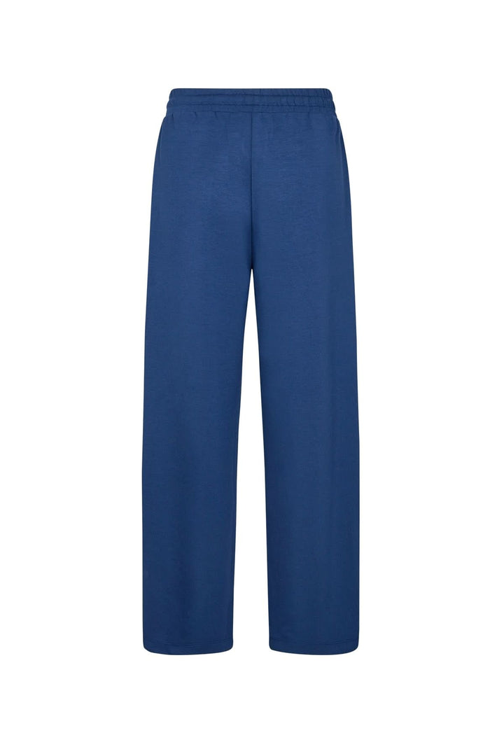 Pantalon large bleu avec taille élastique et cordon ajustable, alliant confort et élégance.