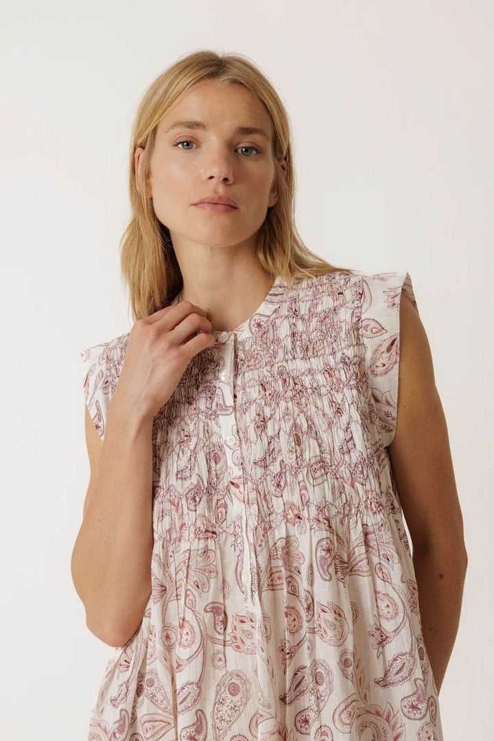 Short, flowing dress with a paisley print