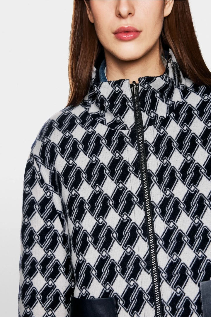 Veste à motif graphique en chaîne géométrique avec fermeture éclair et poches en simili cuir.