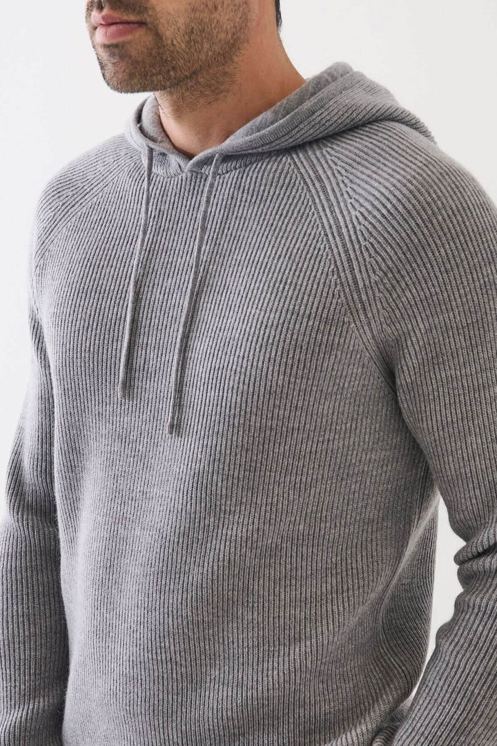 Chandail à capuche en laine mérinos extra-fine côtelée