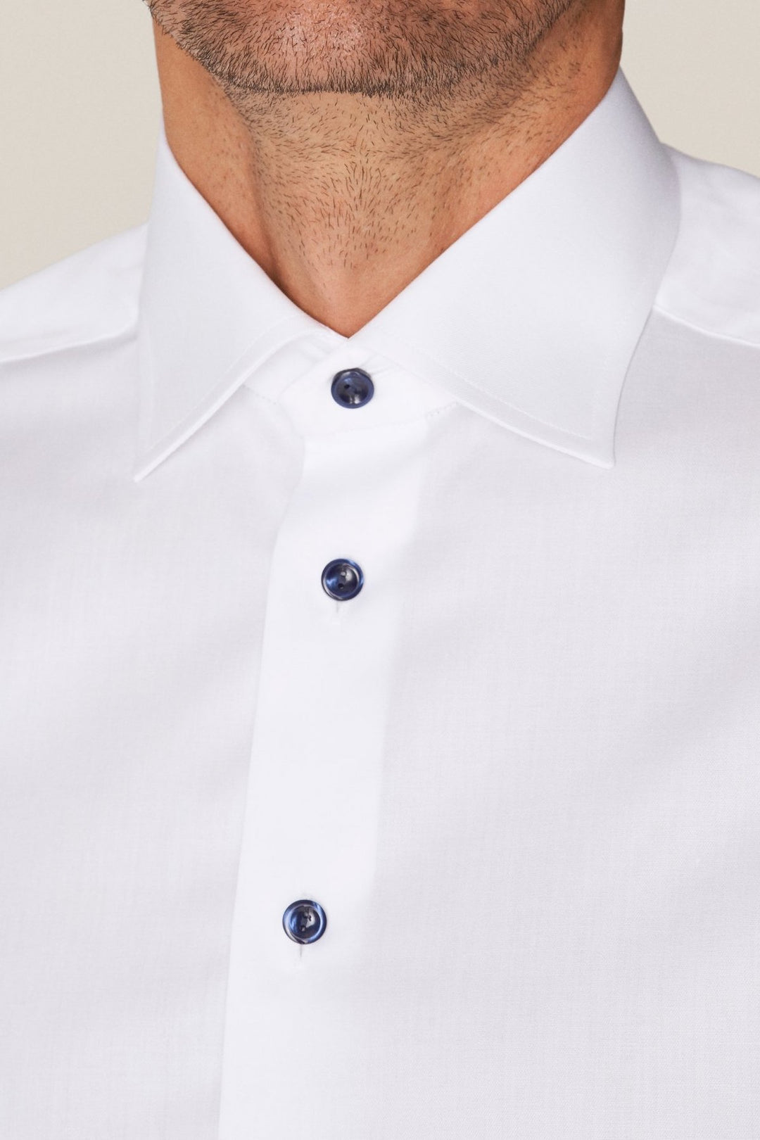 White shirt with navy buttons