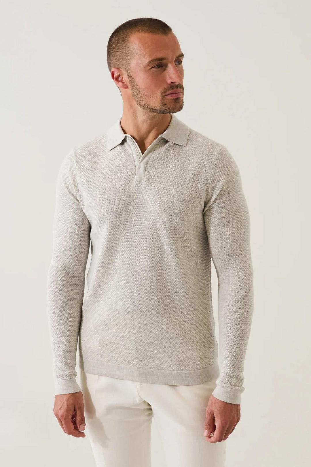 Polo zippé texturé en laine mérinos extra-fine