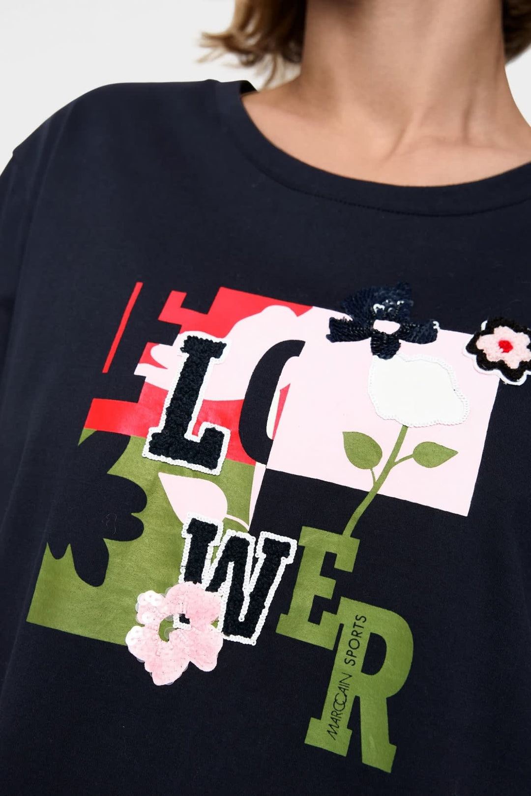 T-shirt à imprimé floral et détails en paillettes vue de face pour femme Marc Cain