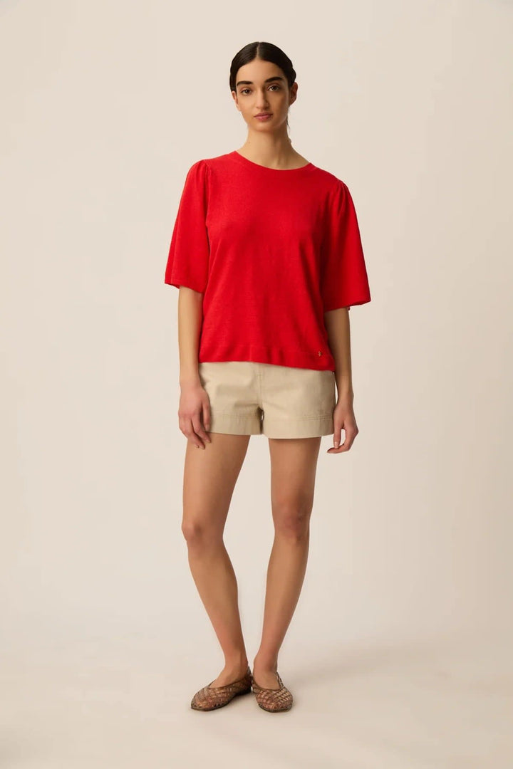 Front view of a knitted T-shirt Des Petits Hauts with short sleeves Pink and a feminine floral pattern - Valérie Simon