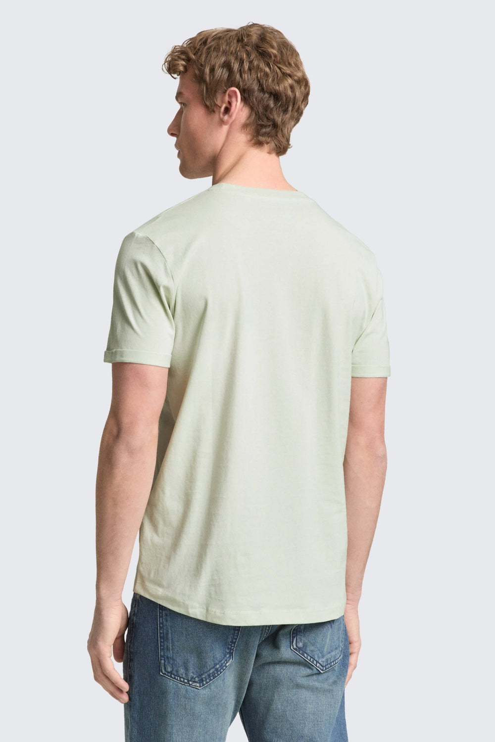 Front view of a gray men's T-shirt with a Tom Tailor logo patch - Valérie Simon