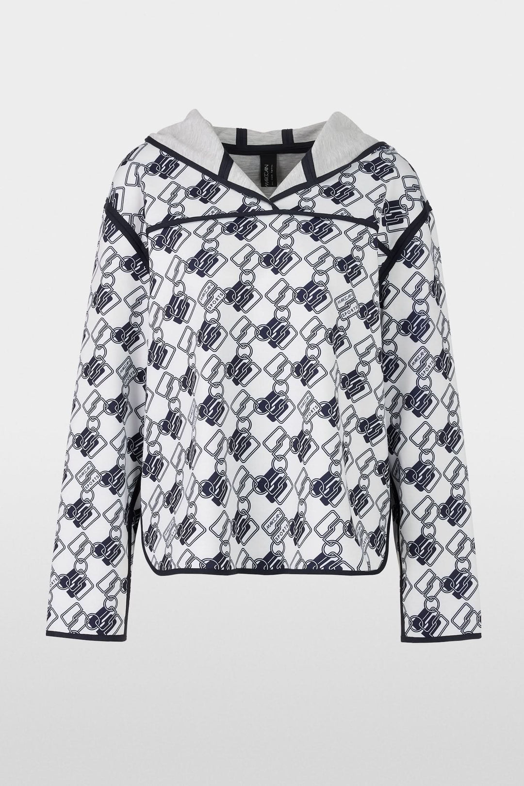 Chandail à capuche réversible avec motif géométrique moderne et coupe ample, côté imprimé.