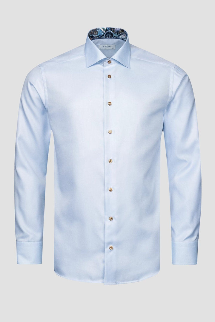 Blue textured shirt with contrasting buttons