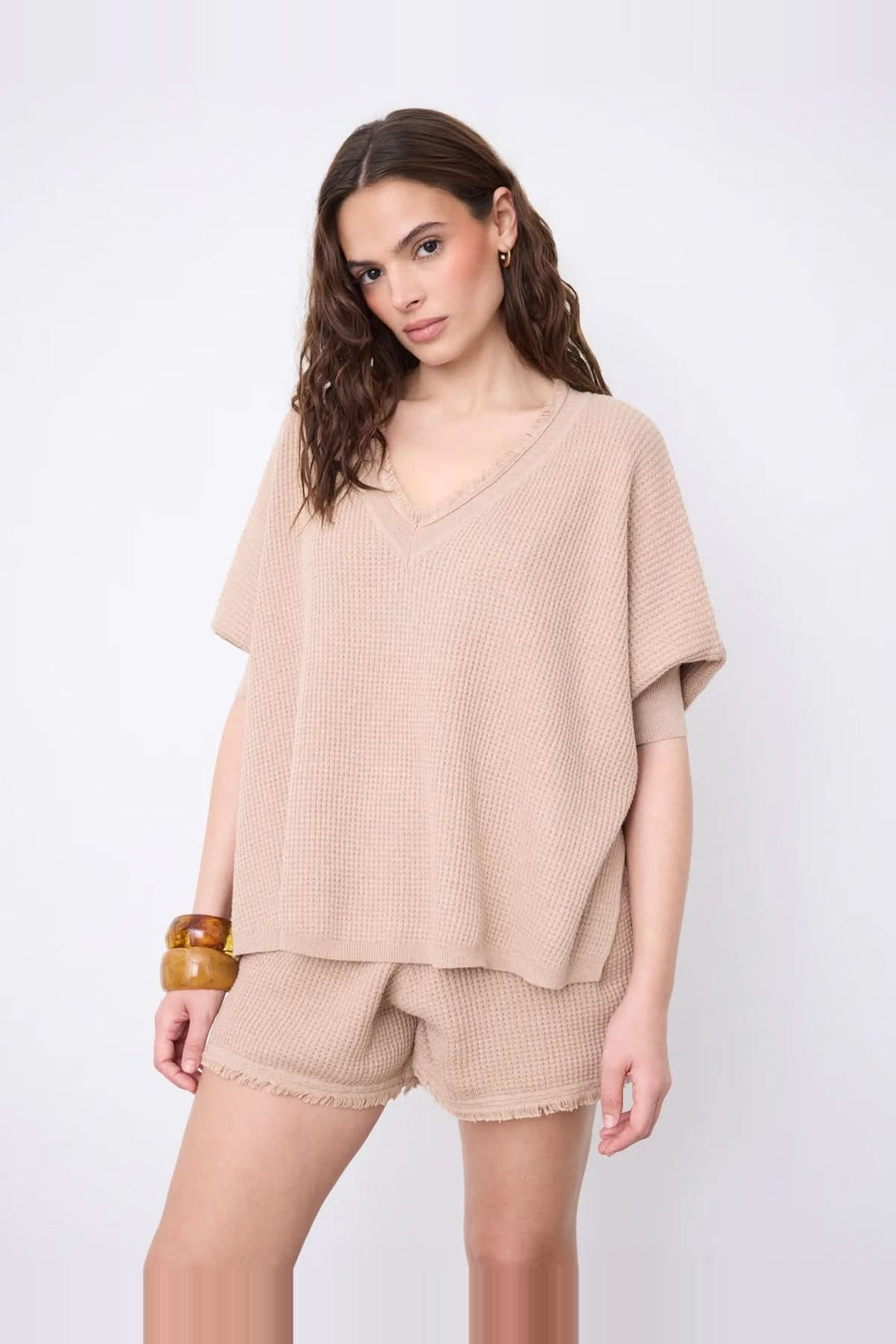 V-neck poncho sweater with three-quarter sleeves